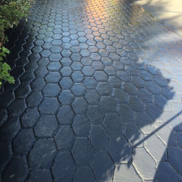 Newly finished concrete path with slate impression in the process of drying
